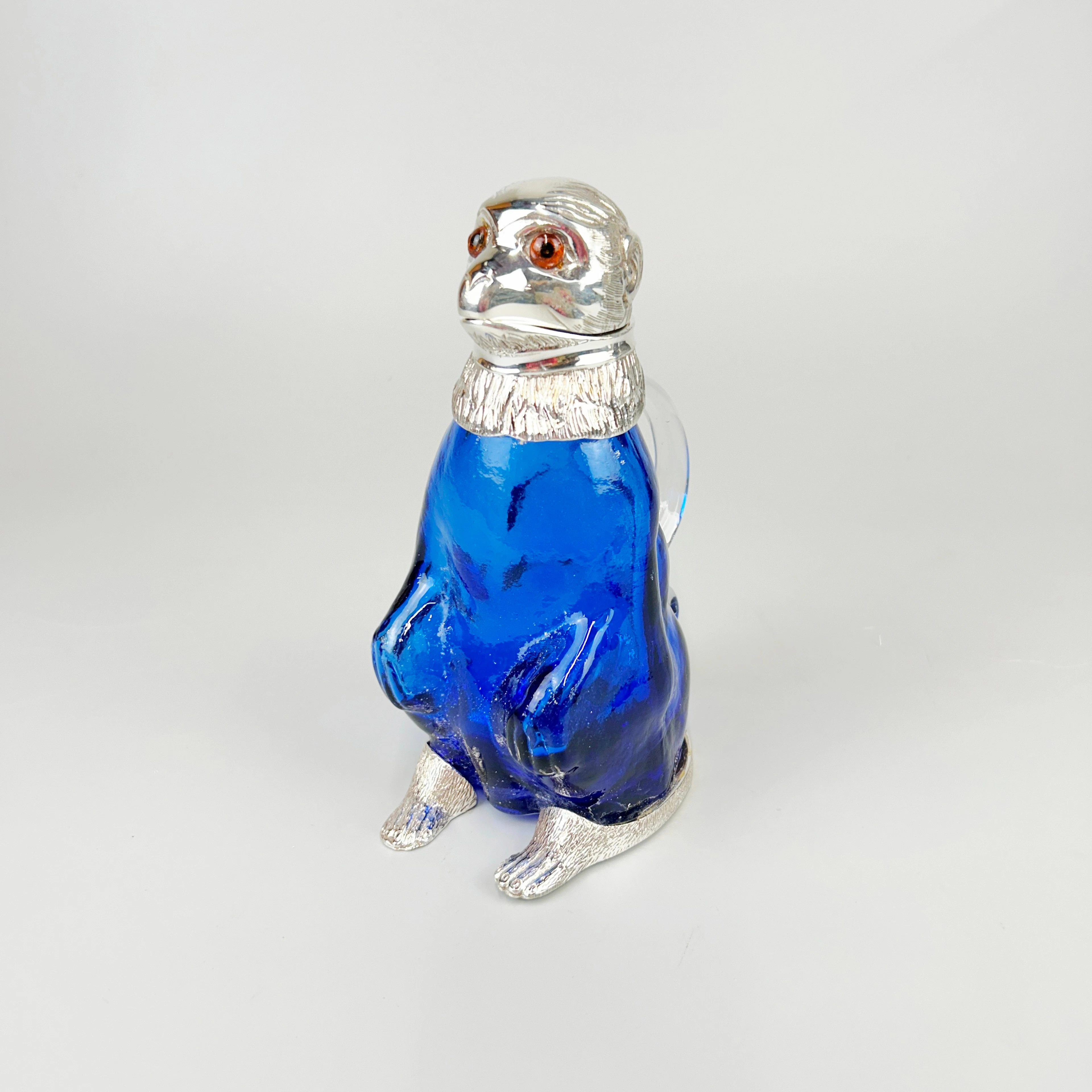 SILVER PLATED & BLUE GLASS MONKEY JUG.