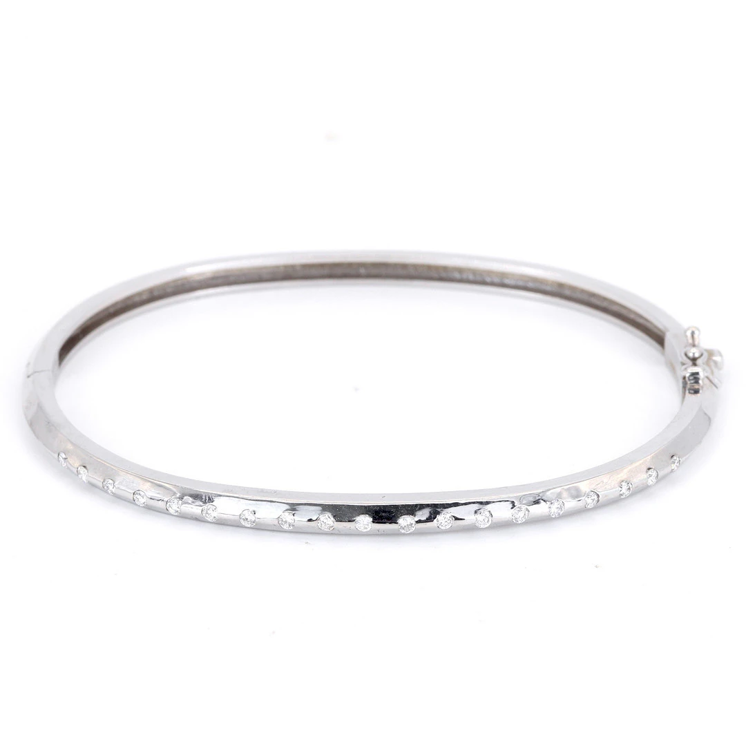 18CT DIAMOND SET BANGLE.