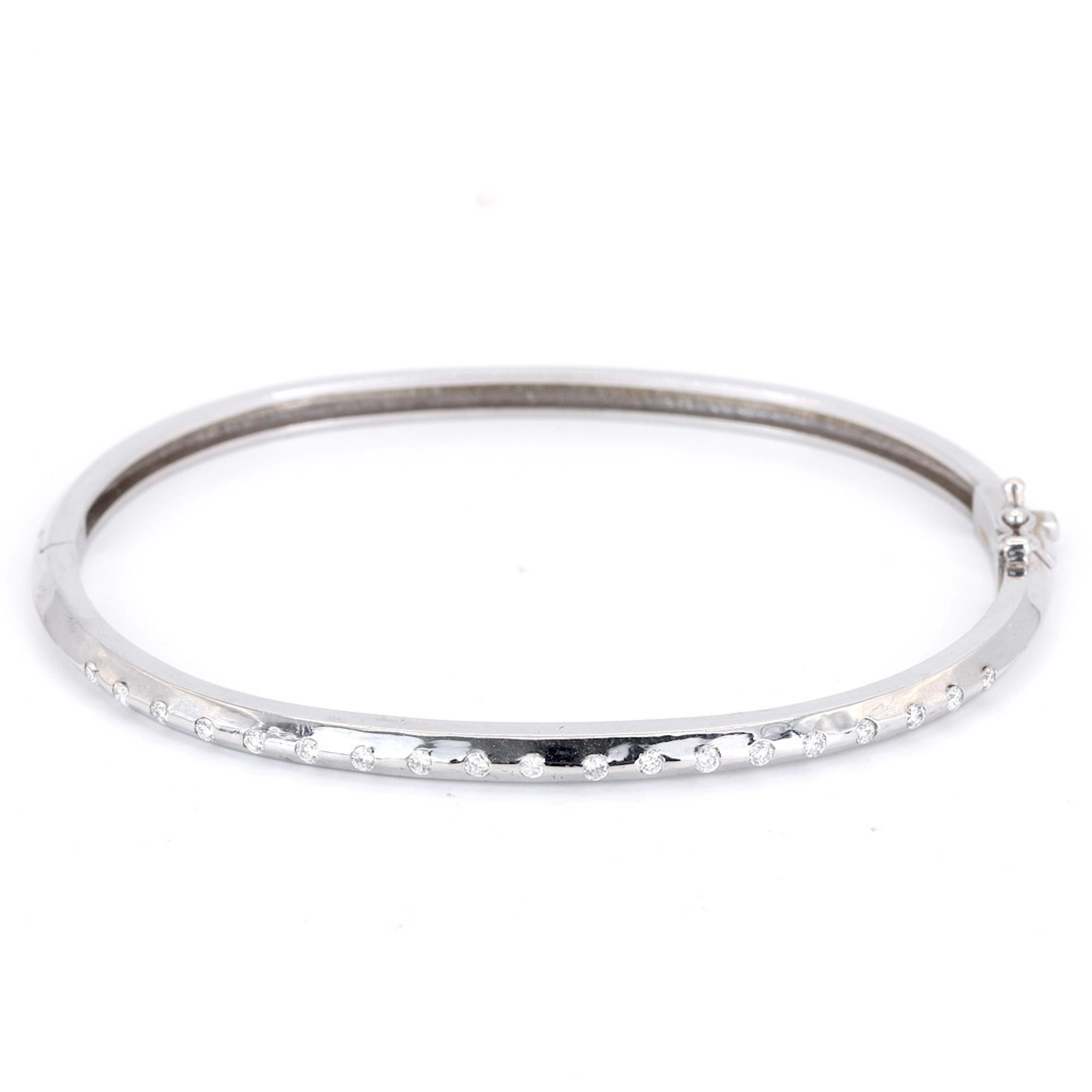 18CT DIAMOND SET BANGLE.