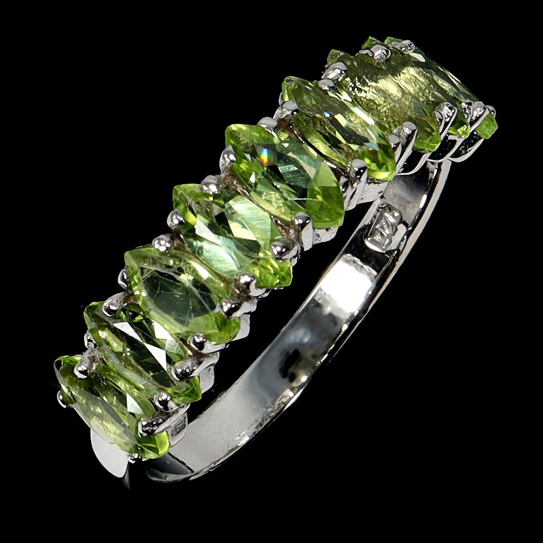 PERIDOT SILVER HALF ETERNITY RING.