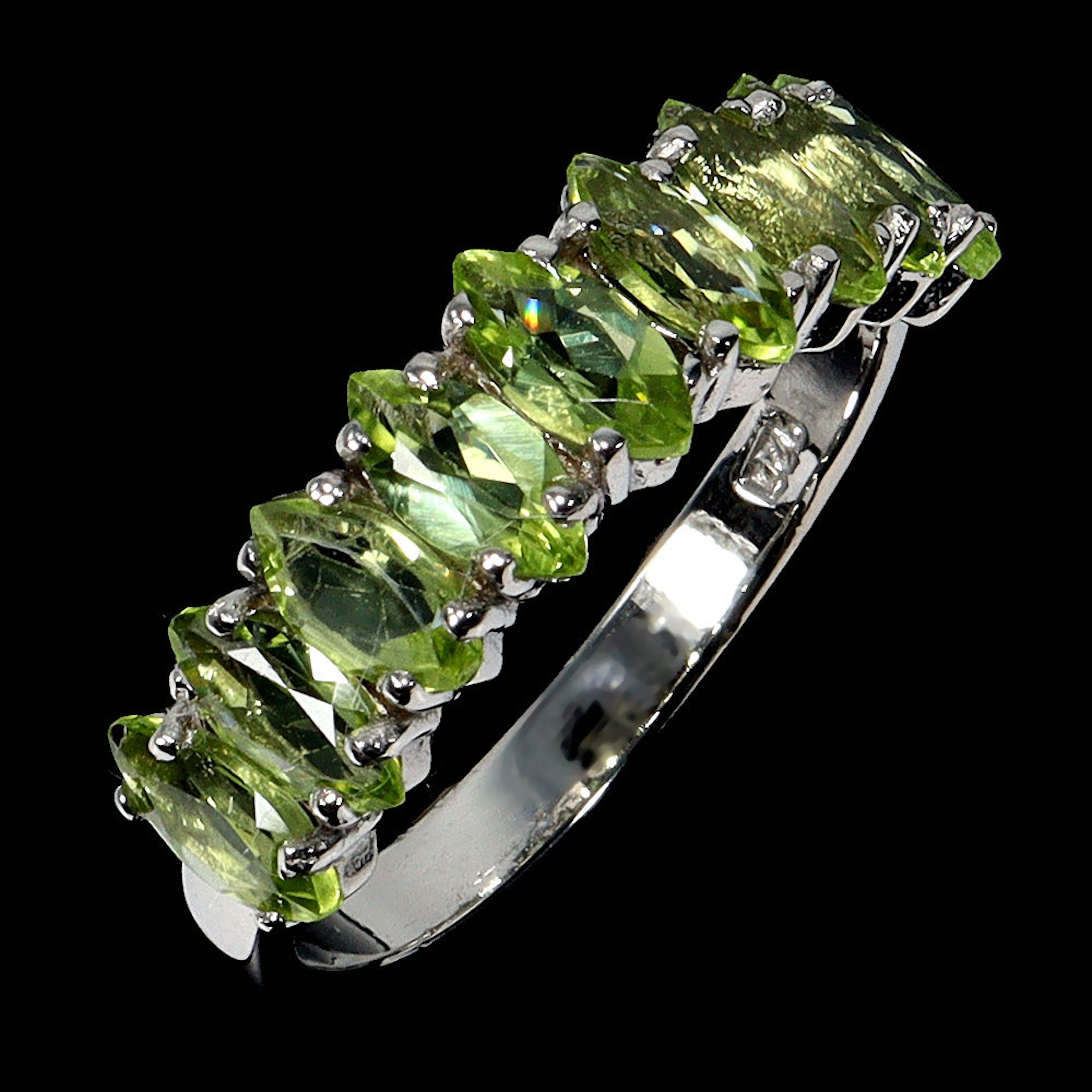 PERIDOT SILVER HALF ETERNITY RING.