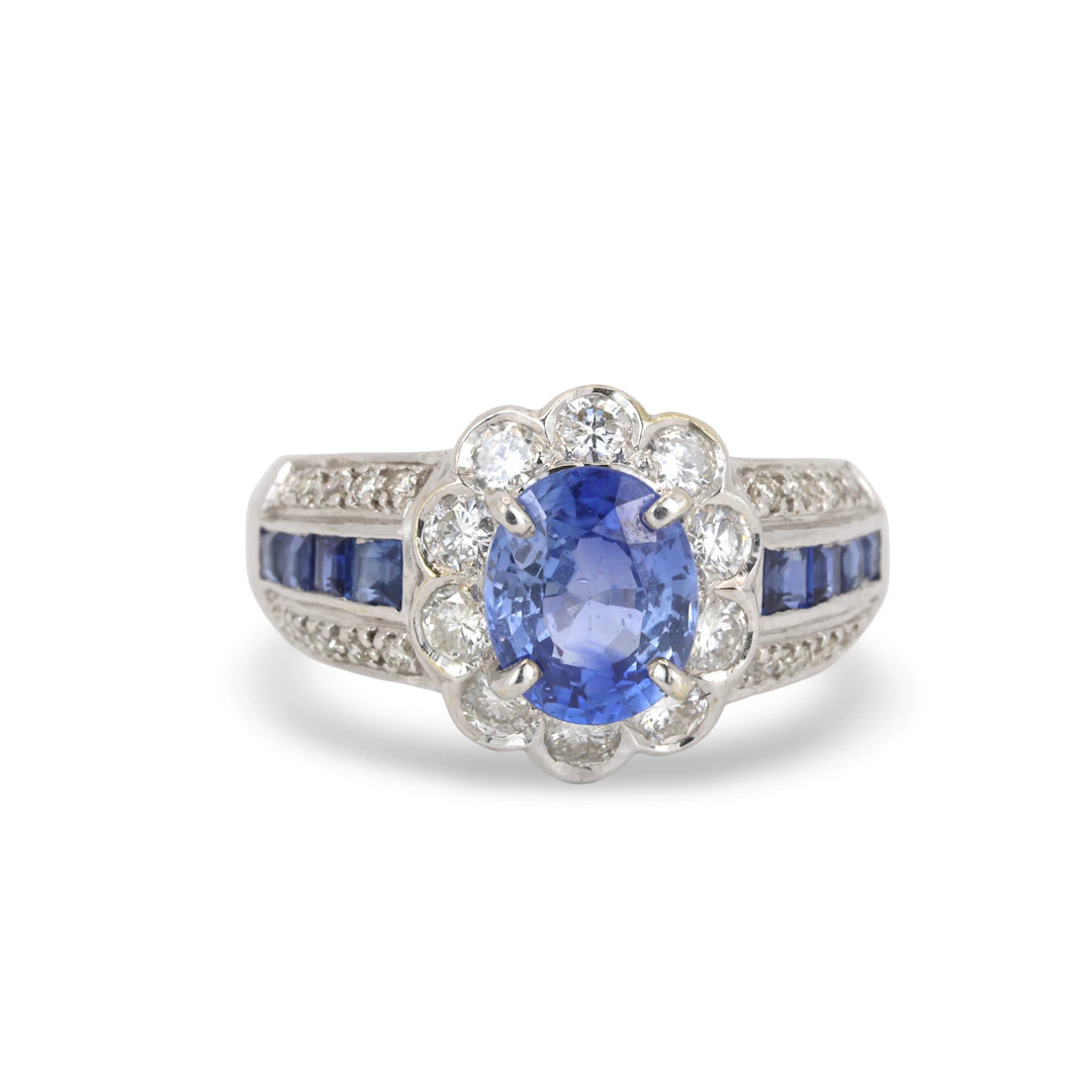 18CT GOLD SAPPHIRE & DIAMOND RING.