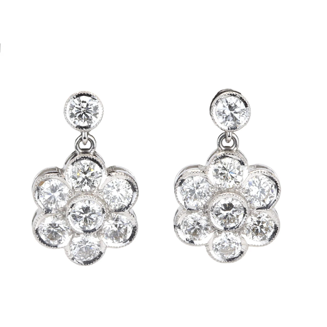18CT WHITE GOLD DAISY 3.10CT DIA EARRINGS.