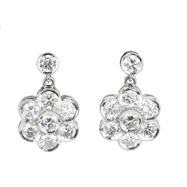18CT WHITE GOLD DAISY 3.10CT DIA EARRINGS.