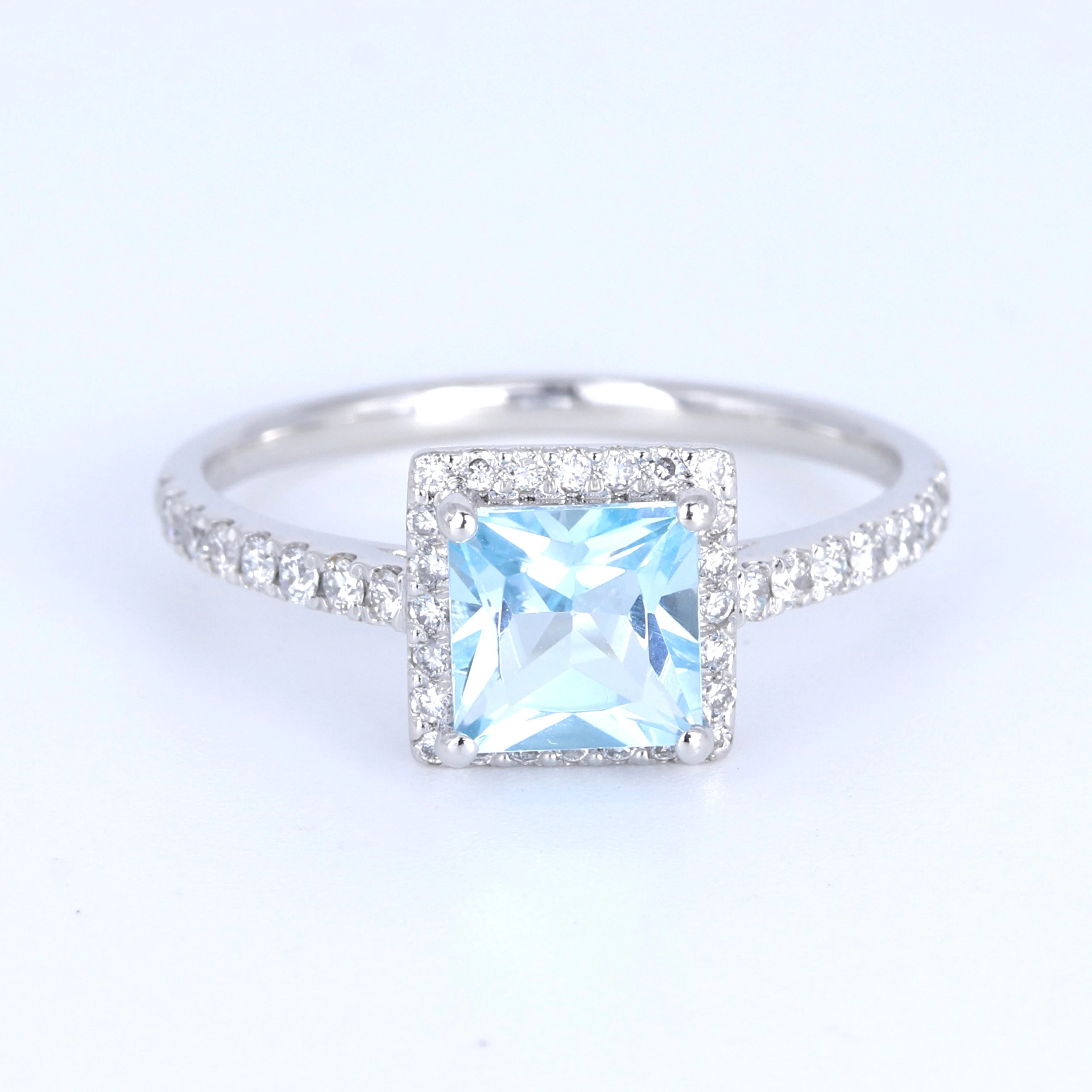 PLATINUM BLUE TOPAZ AND DIAMOND RING.