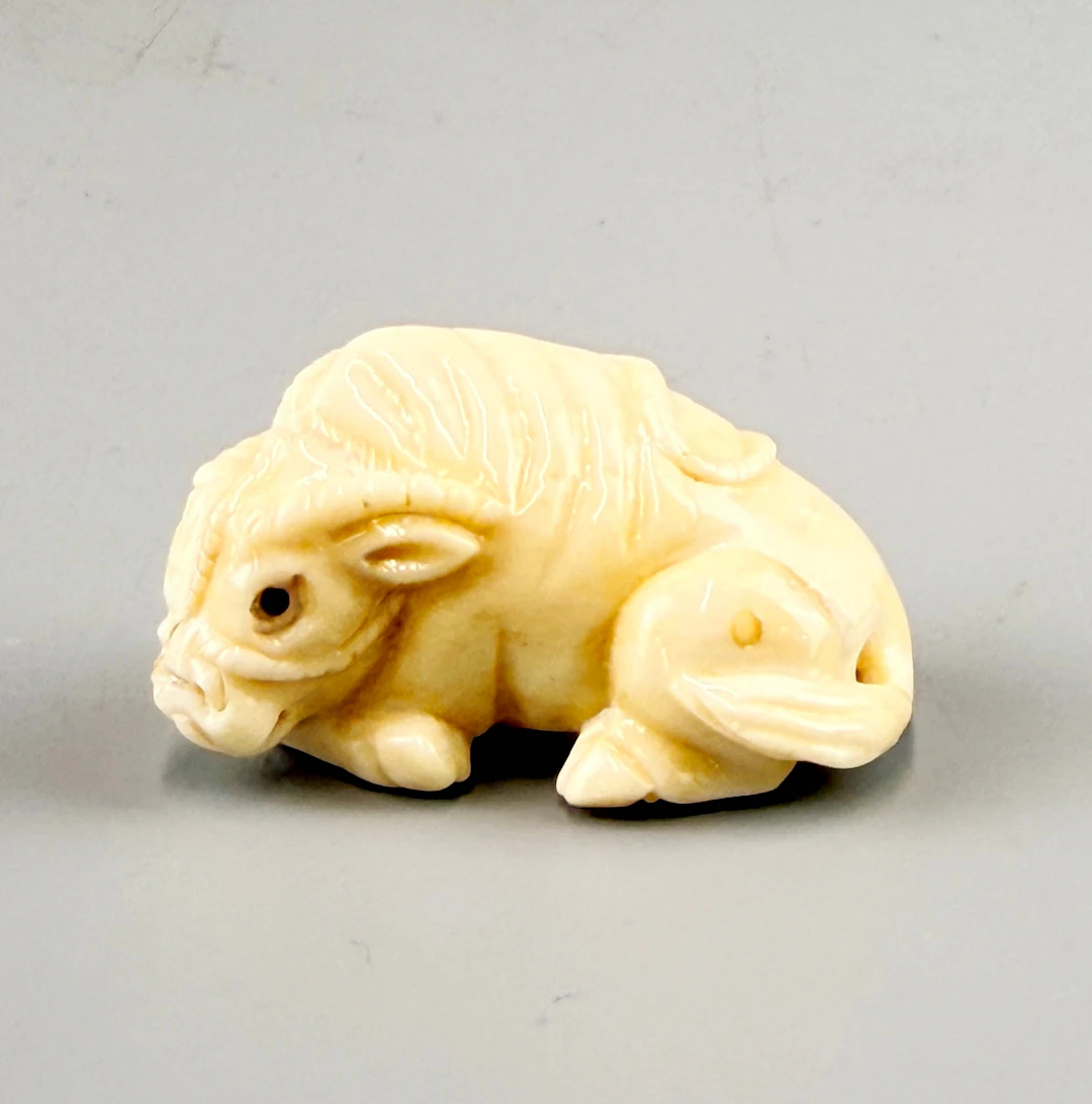CARVED BONE NETSUKE.