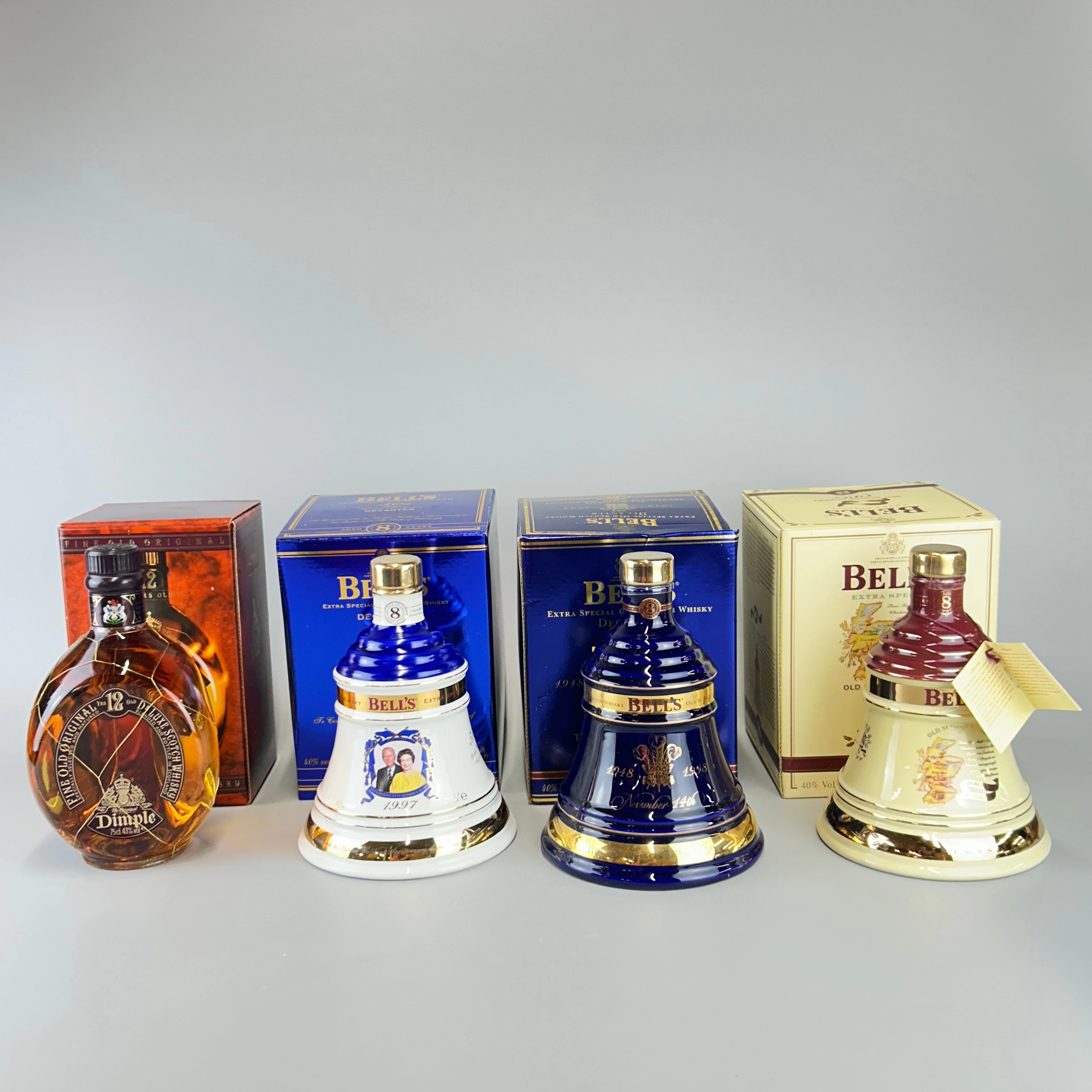 FOUR BOTTLES OF WHISKEY.