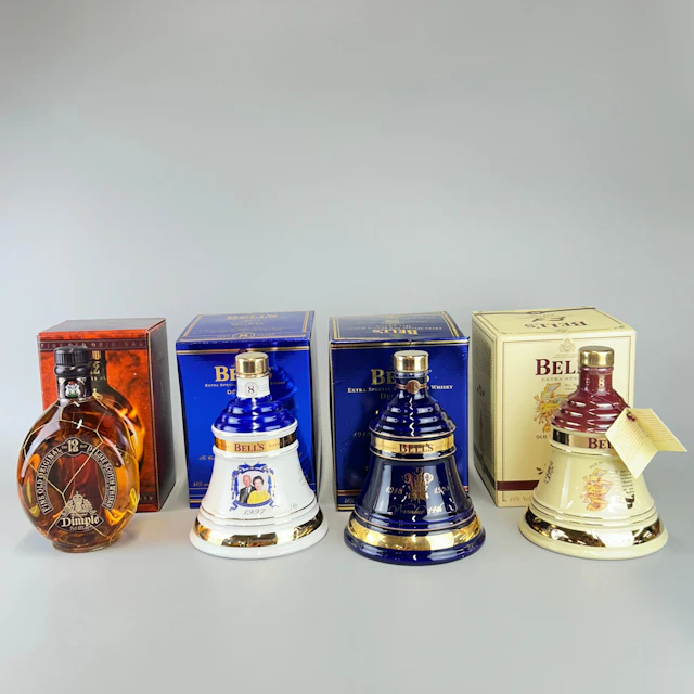 FOUR BOTTLES OF WHISKEY.