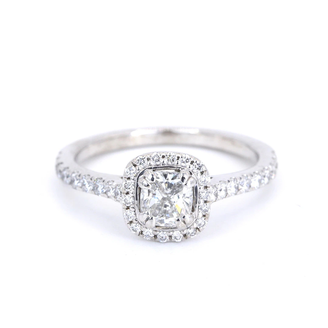 0.9 CT DIAMOND HALO RING.