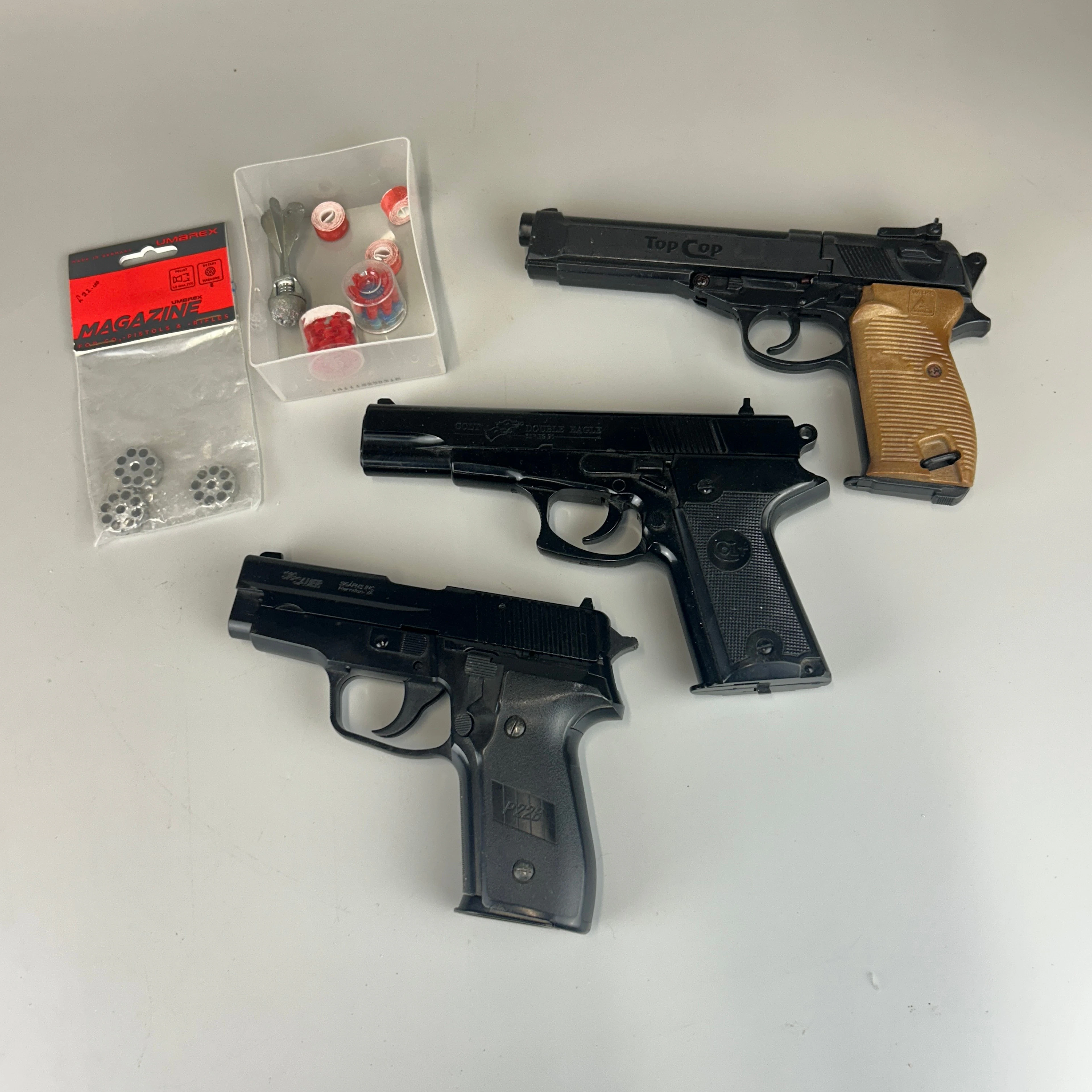 THREE TOY PISTOLS.