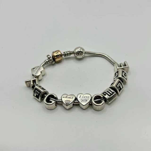 SILVER PANDORA CHARM BRACELET.