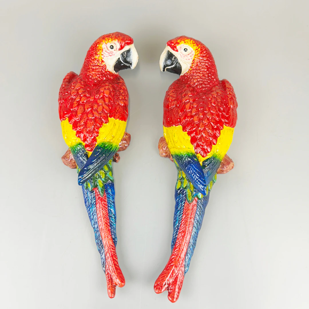 CAST IRON PARROTS.