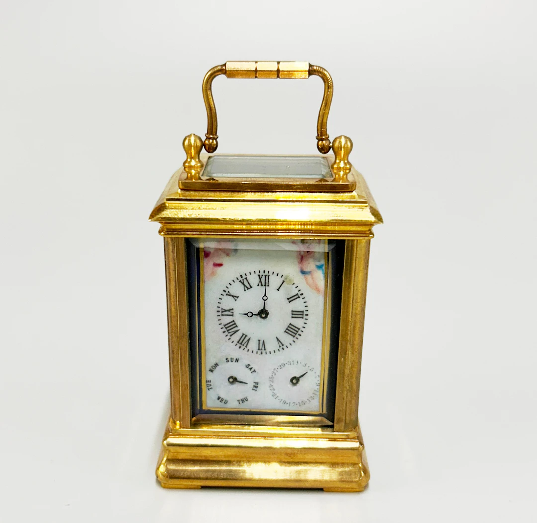 CHERUB CARRIAGE CLOCK.