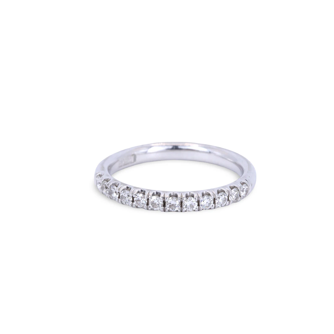 PLATINUM DIAMOND HALF ETERNITY RING.