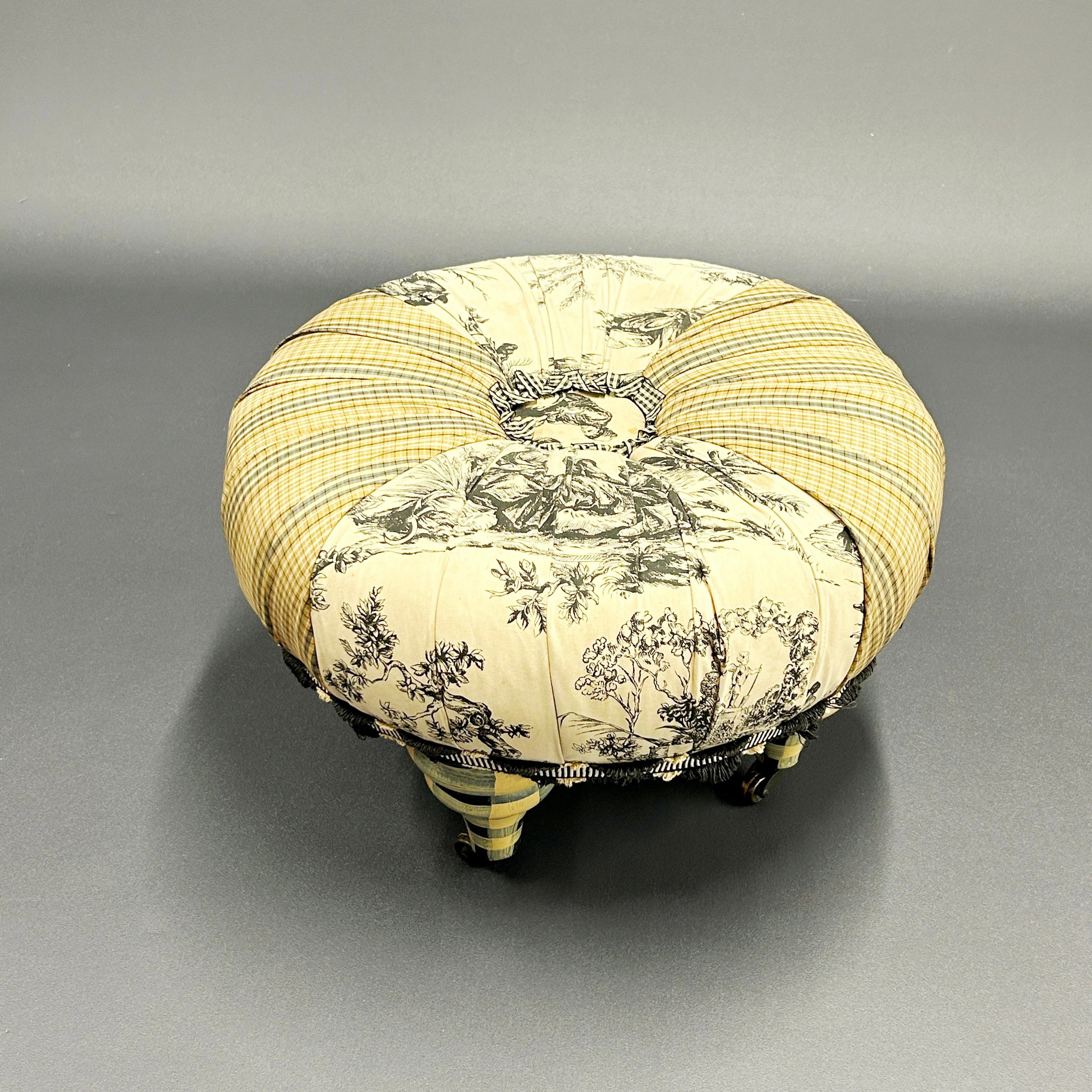 UPHOLSTERED FOOTSTOOL.