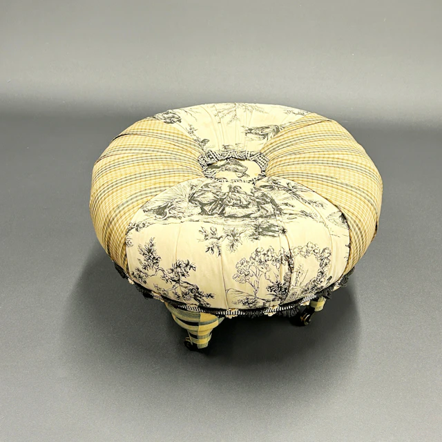 UPHOLSTERED FOOTSTOOL.