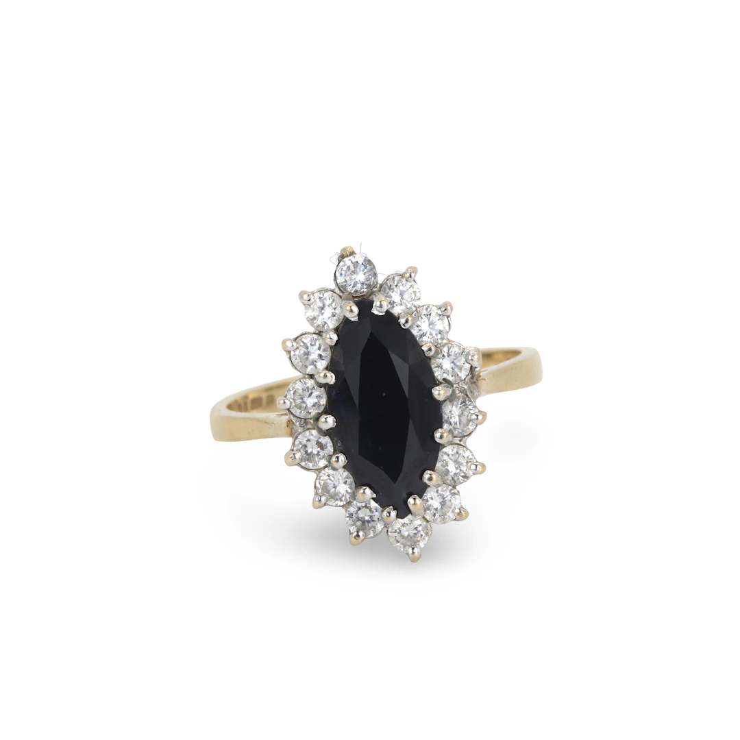 9CT GOLD SAPPHIRE AND CUBIC RING.