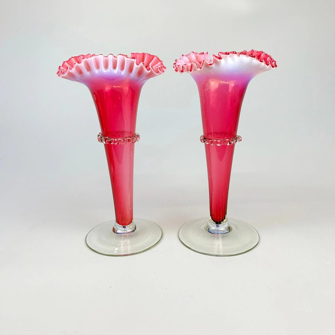 PAIR OF CRANBERRY GLASS VASES.