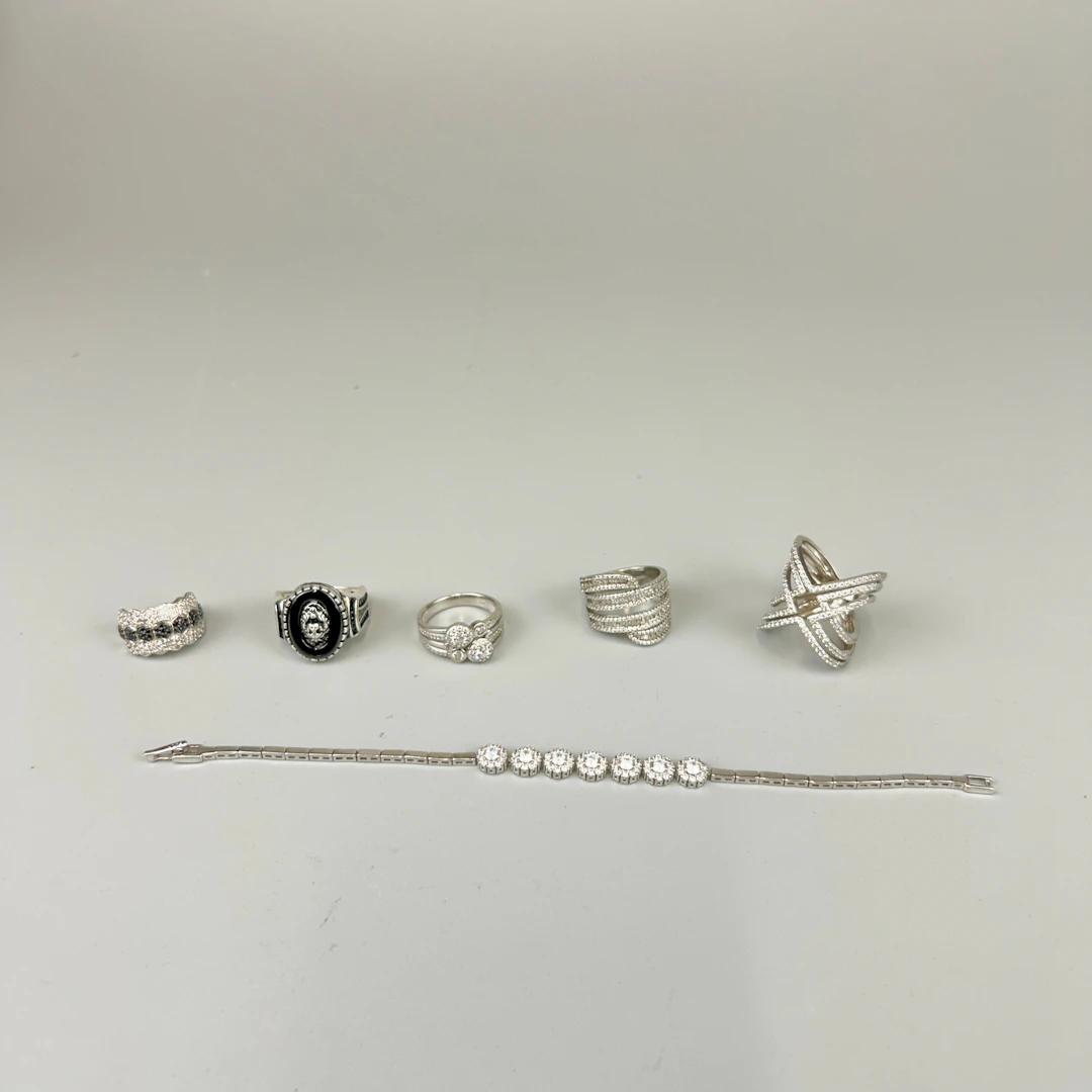 FOUR WHITE STONE SET RINGS ETC.