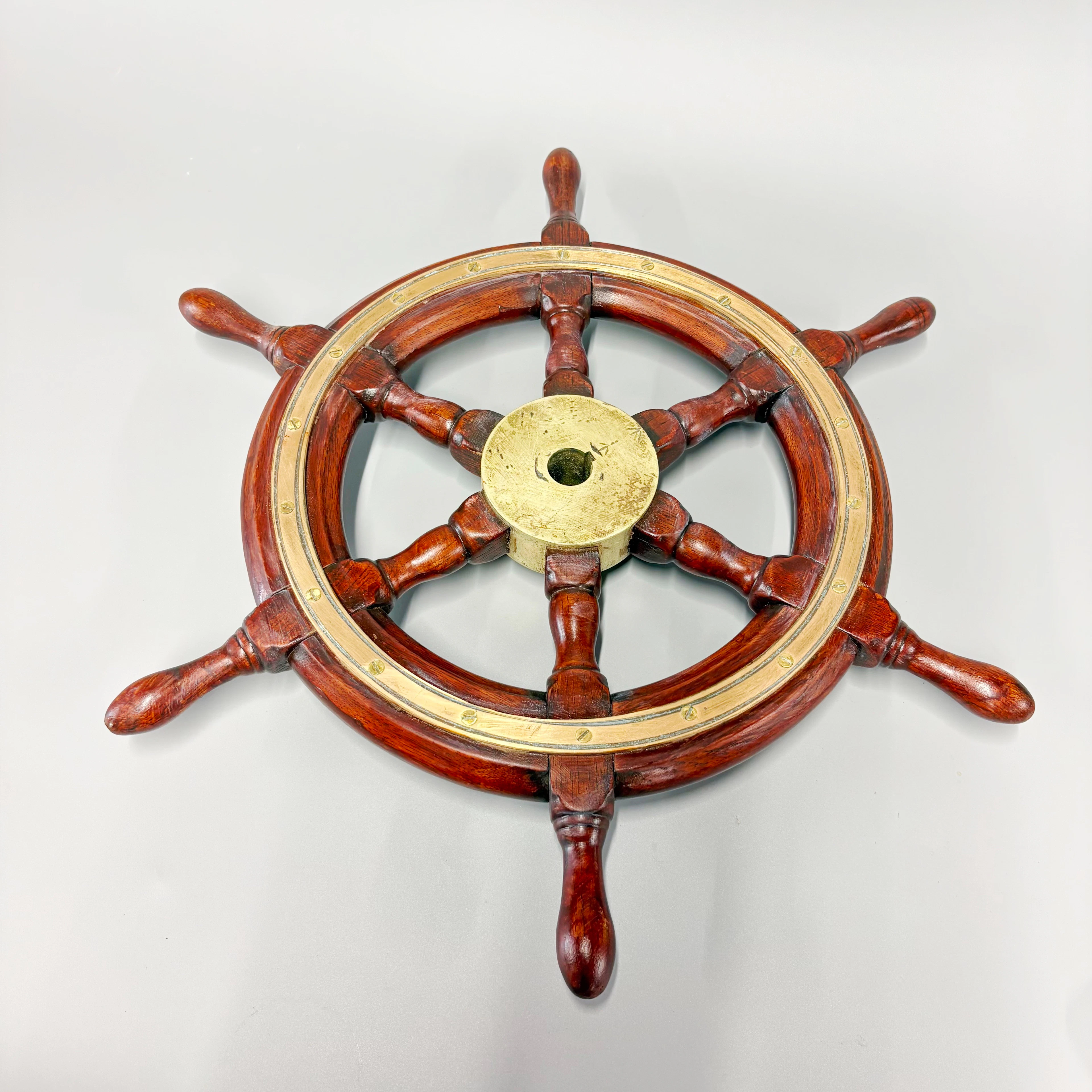 BRASS MOUNTED SHIP'S WHEEL.