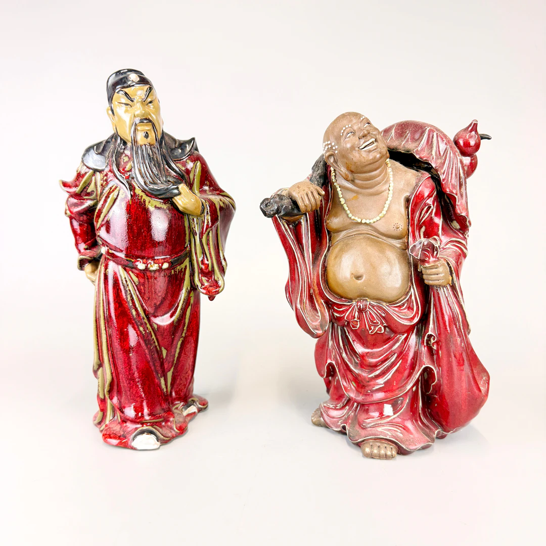 TWO STONEWARE GUARDIAN FIGURES.