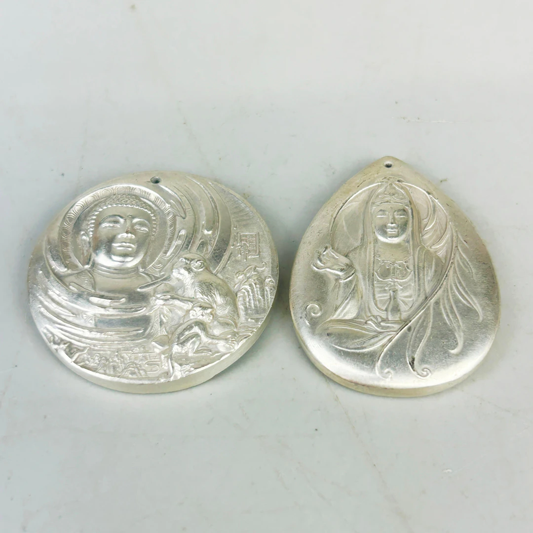 TWO CHINESE PENDANTS.