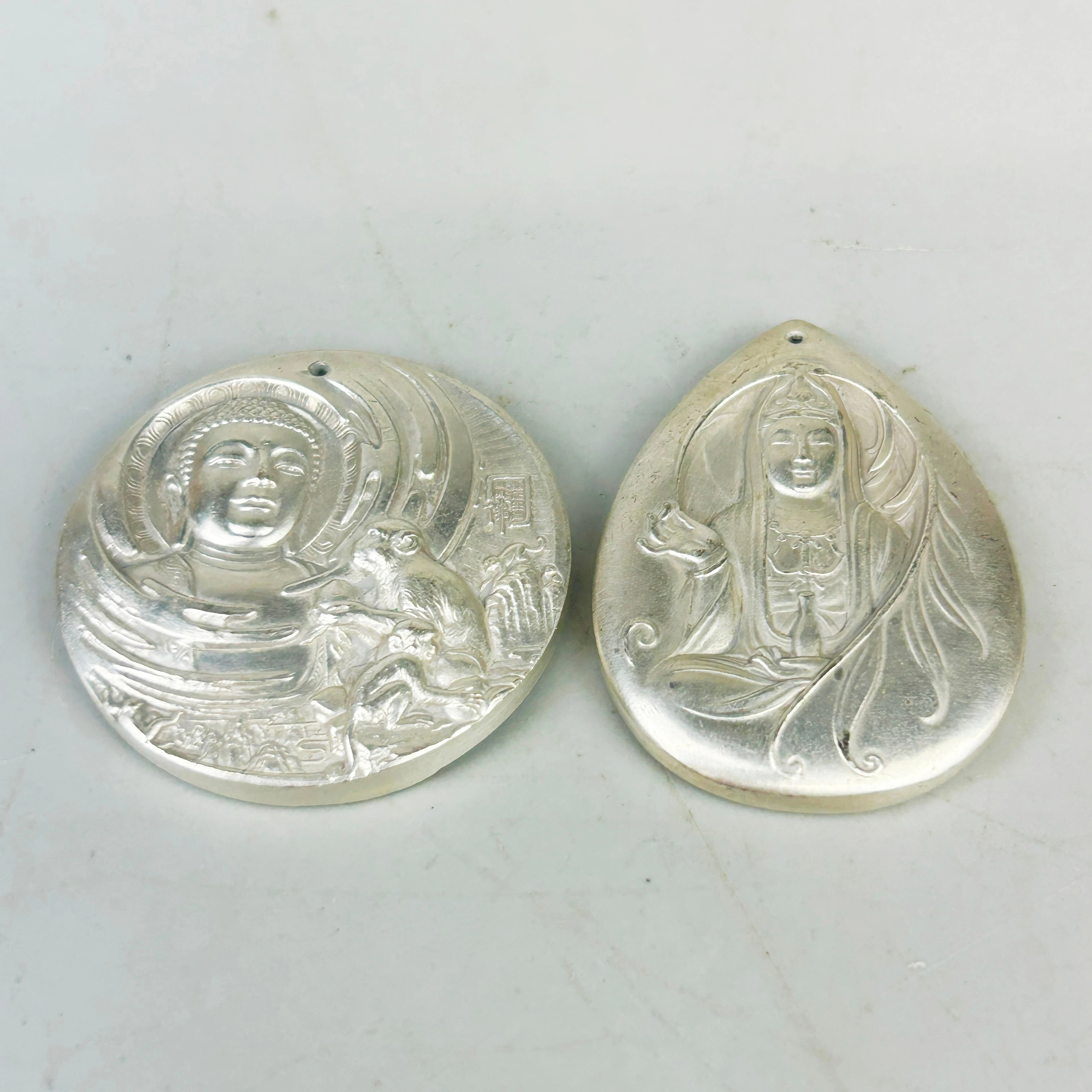 TWO CHINESE PENDANTS.