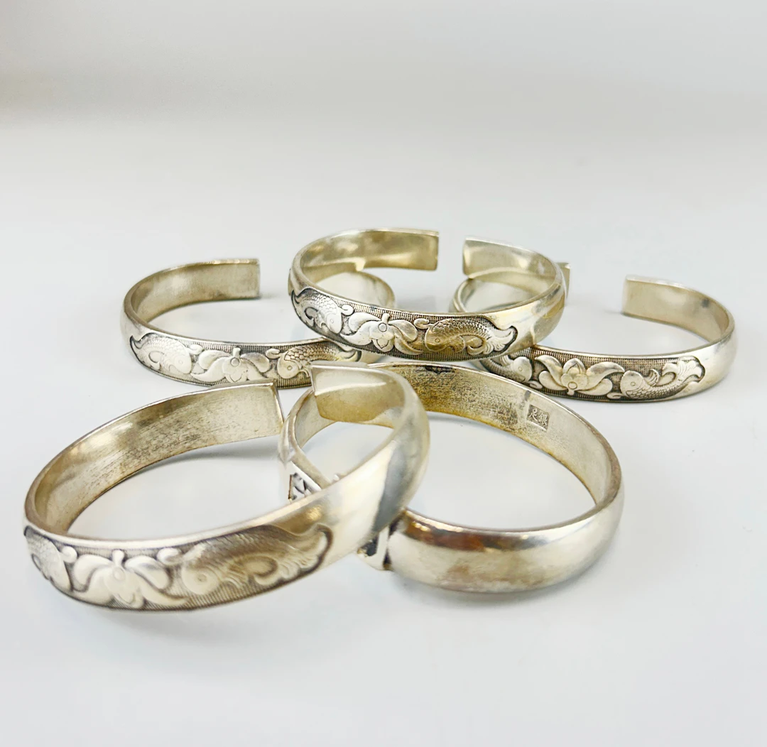 CHINESE WHITE METAL BANGLES.