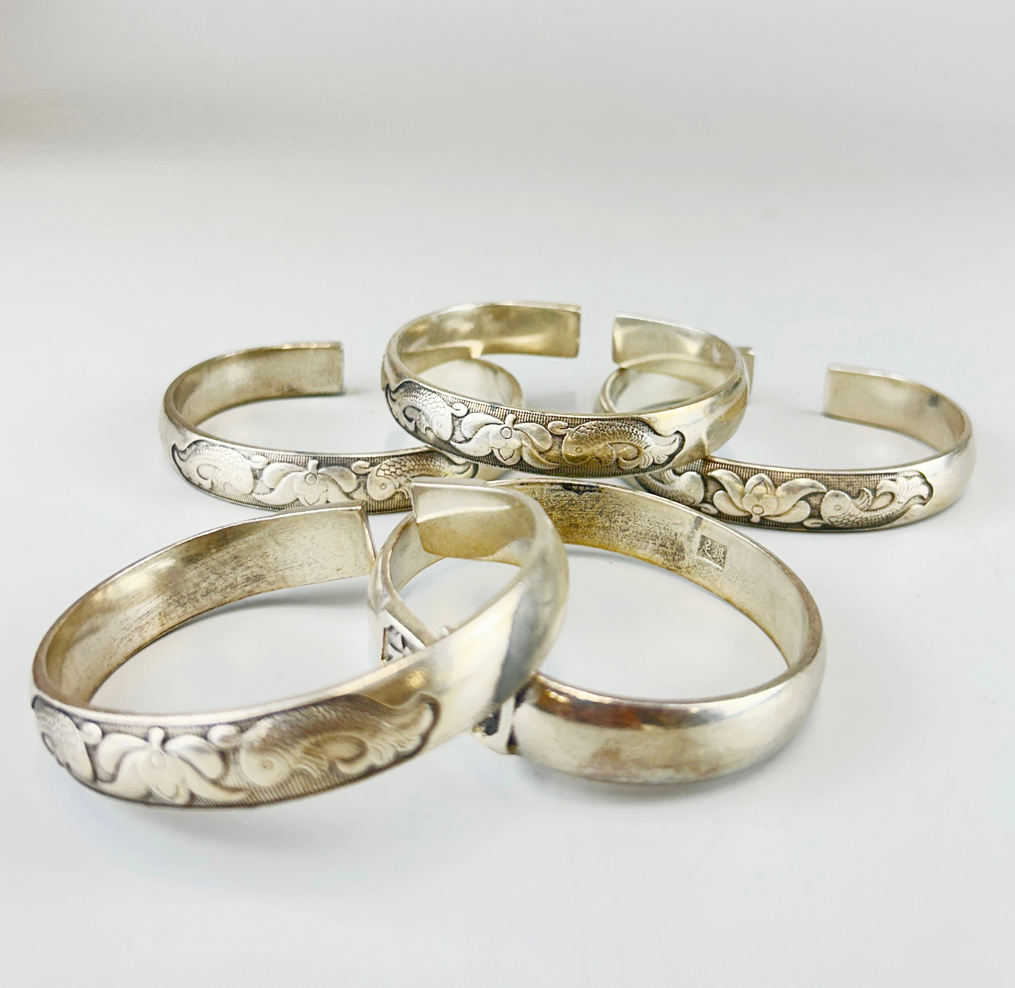 CHINESE WHITE METAL BANGLES.