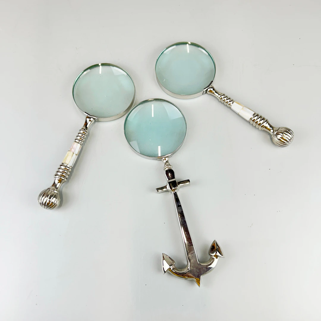 THREE MAGNIFYING GLASSES.