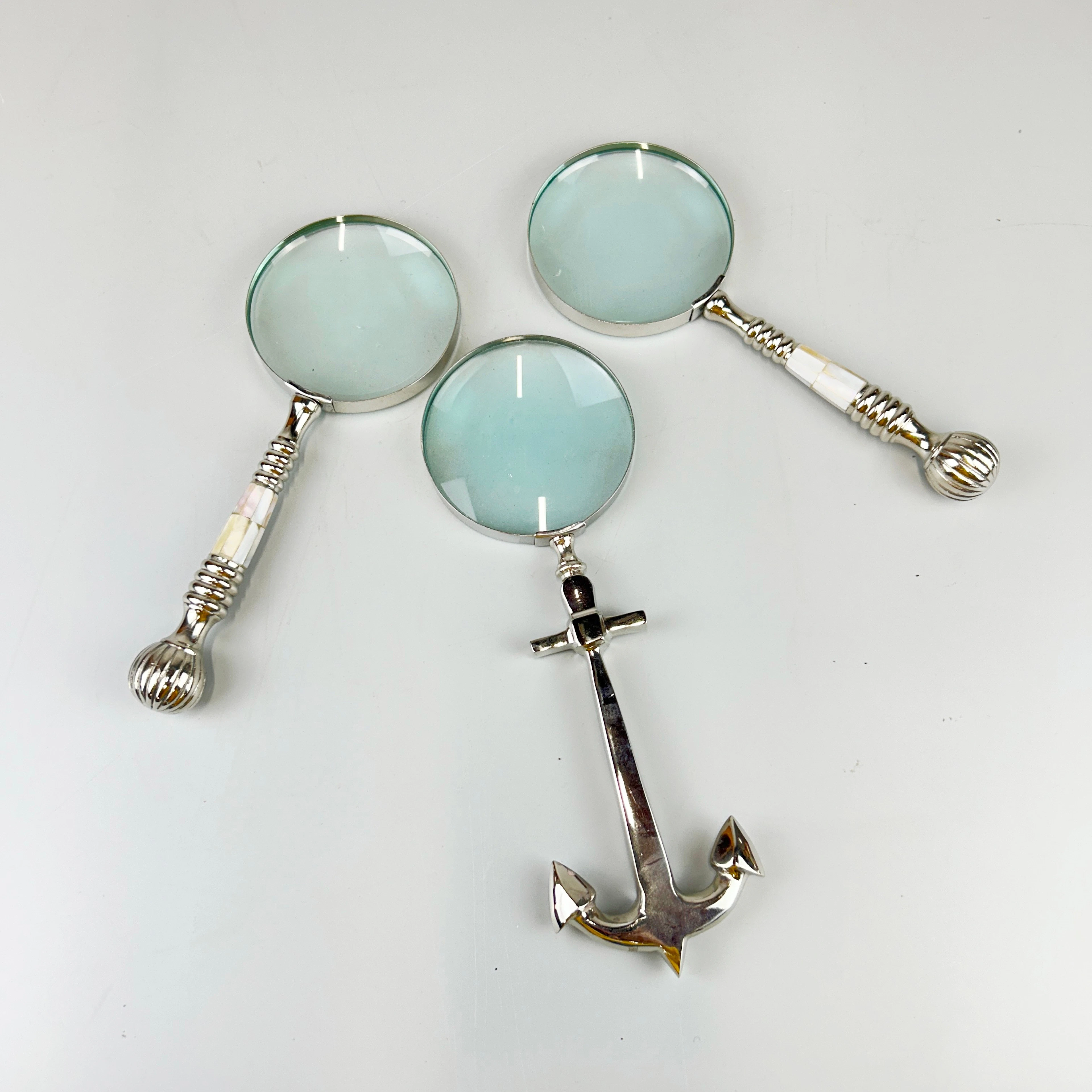 THREE MAGNIFYING GLASSES.