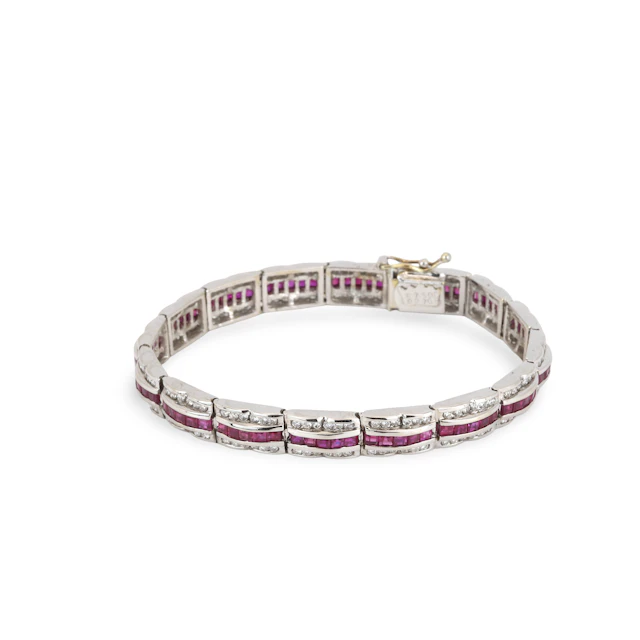 18CT GOLD RUBY & DIAMOND BRACELET.