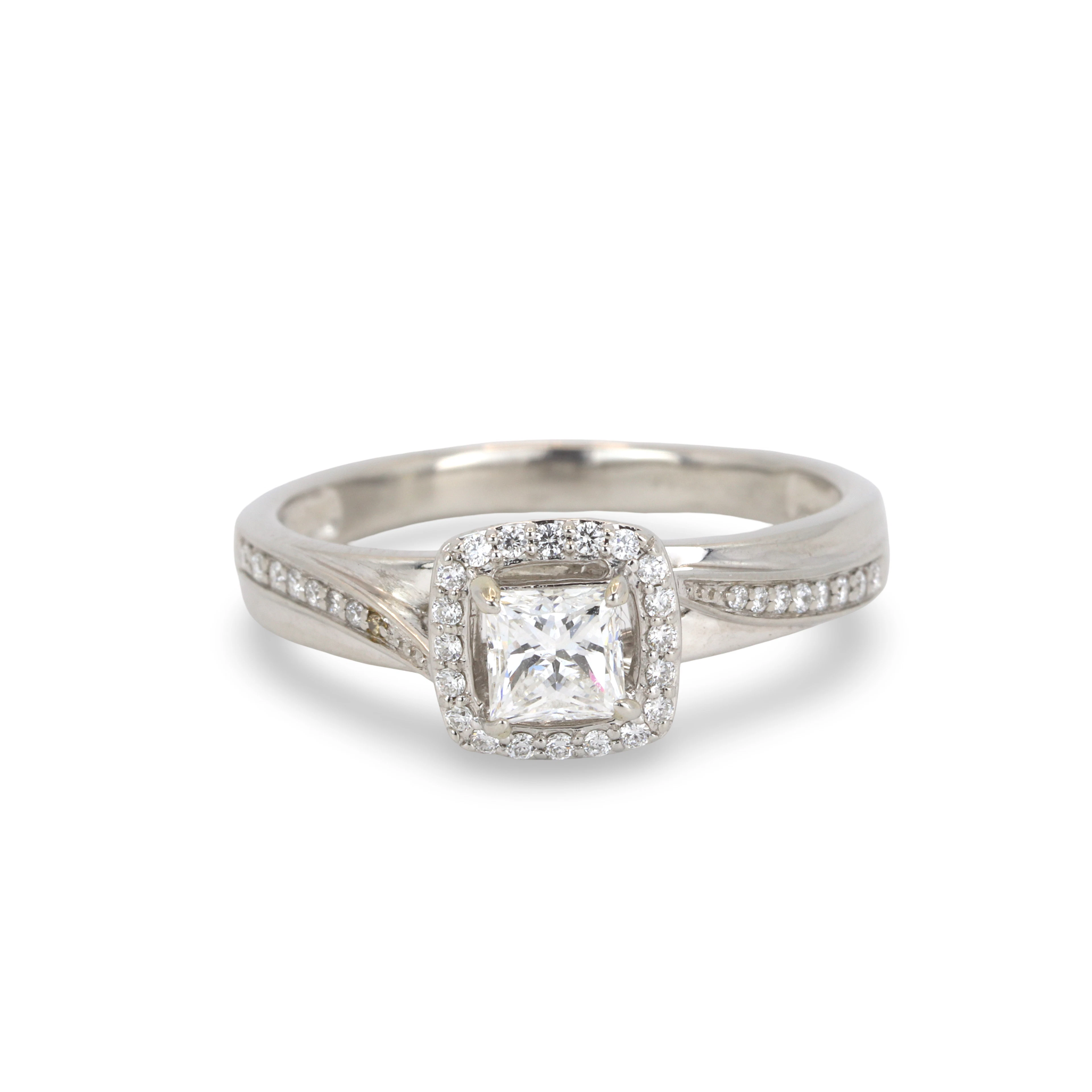 PLATINUM (1.06CT) DIAMOND HALO RING.