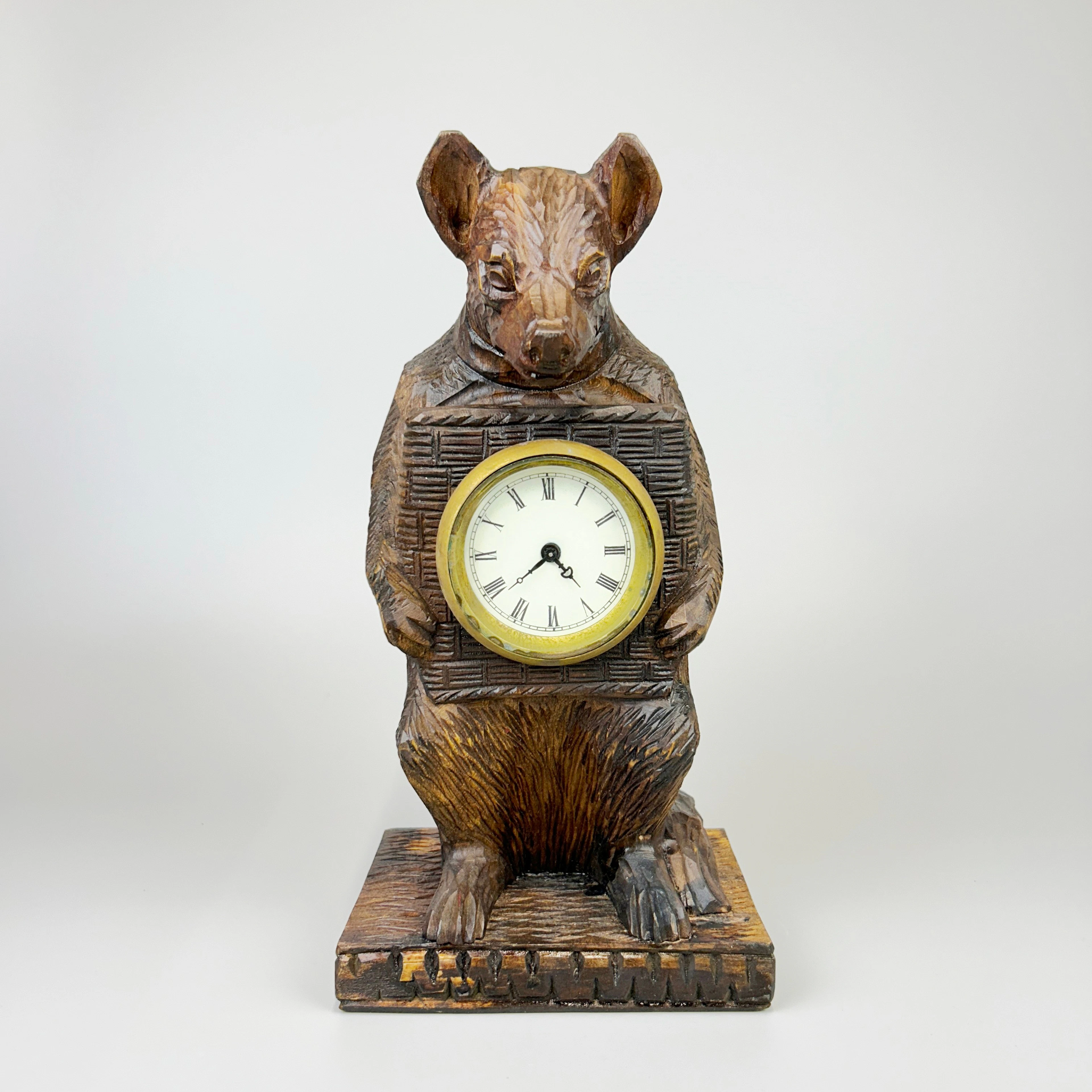 A BLACK FOREST STYLE CLOCK.