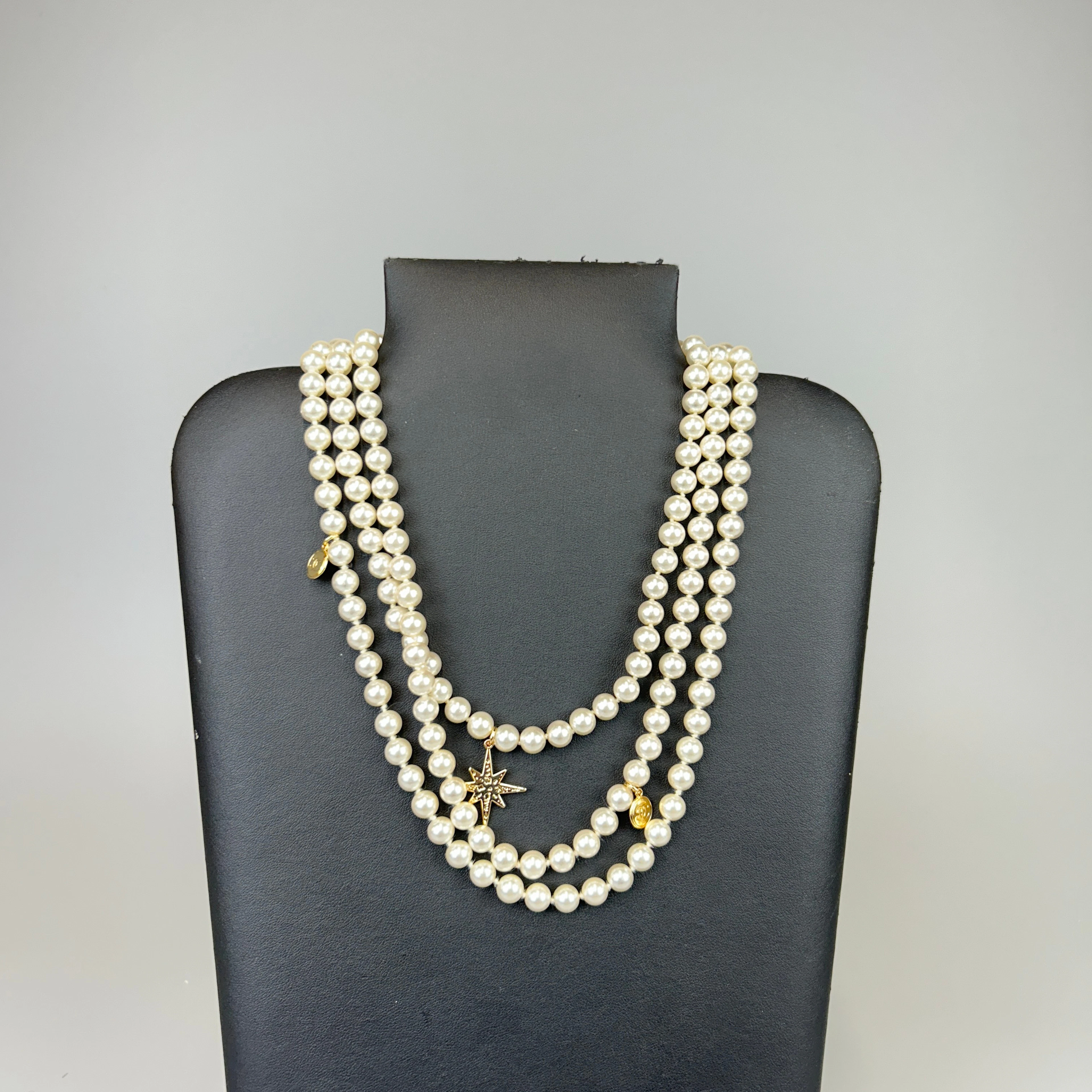 THREE STRAND FAUX PEARL NECKLACE.