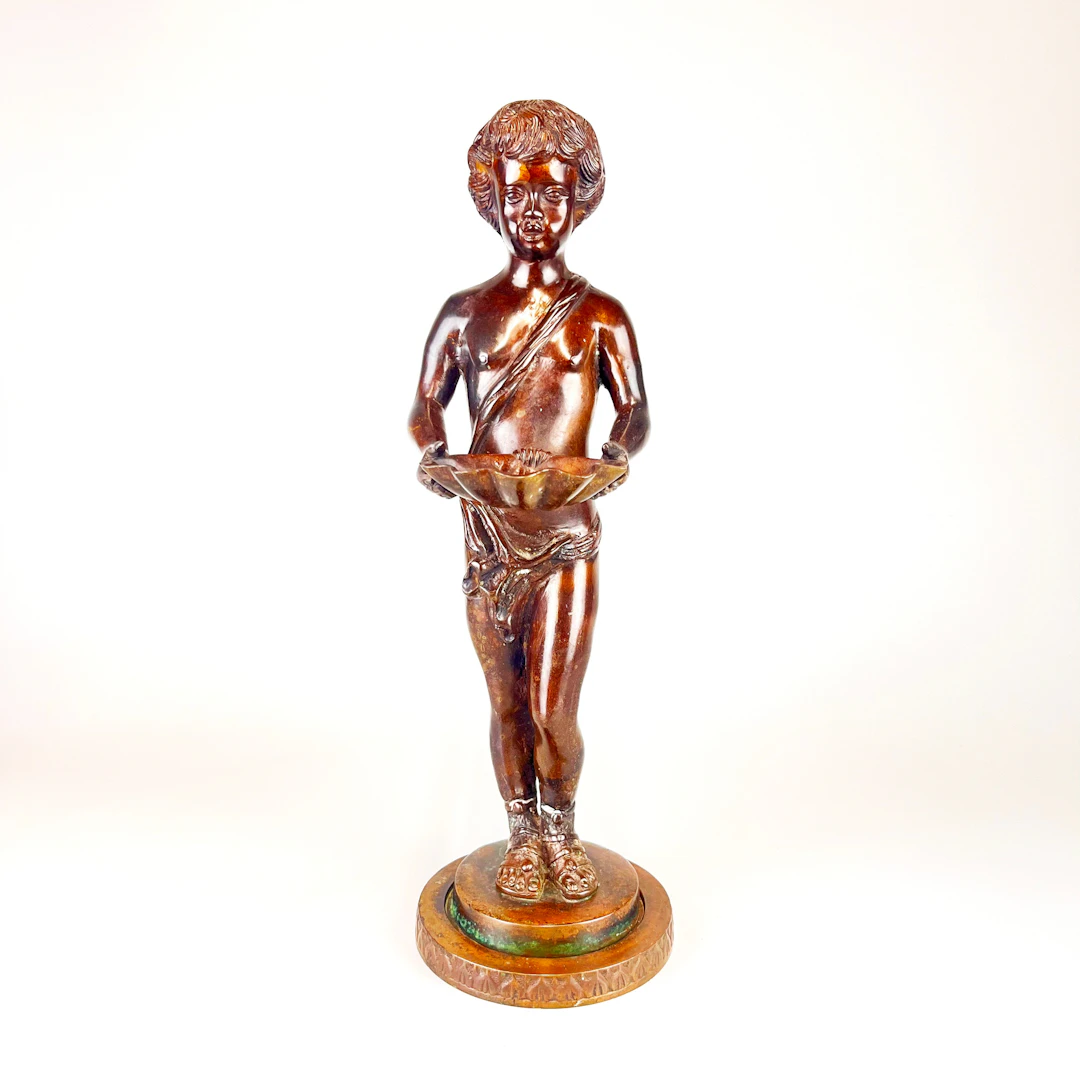 BRONZE FIGURE OF BOY.