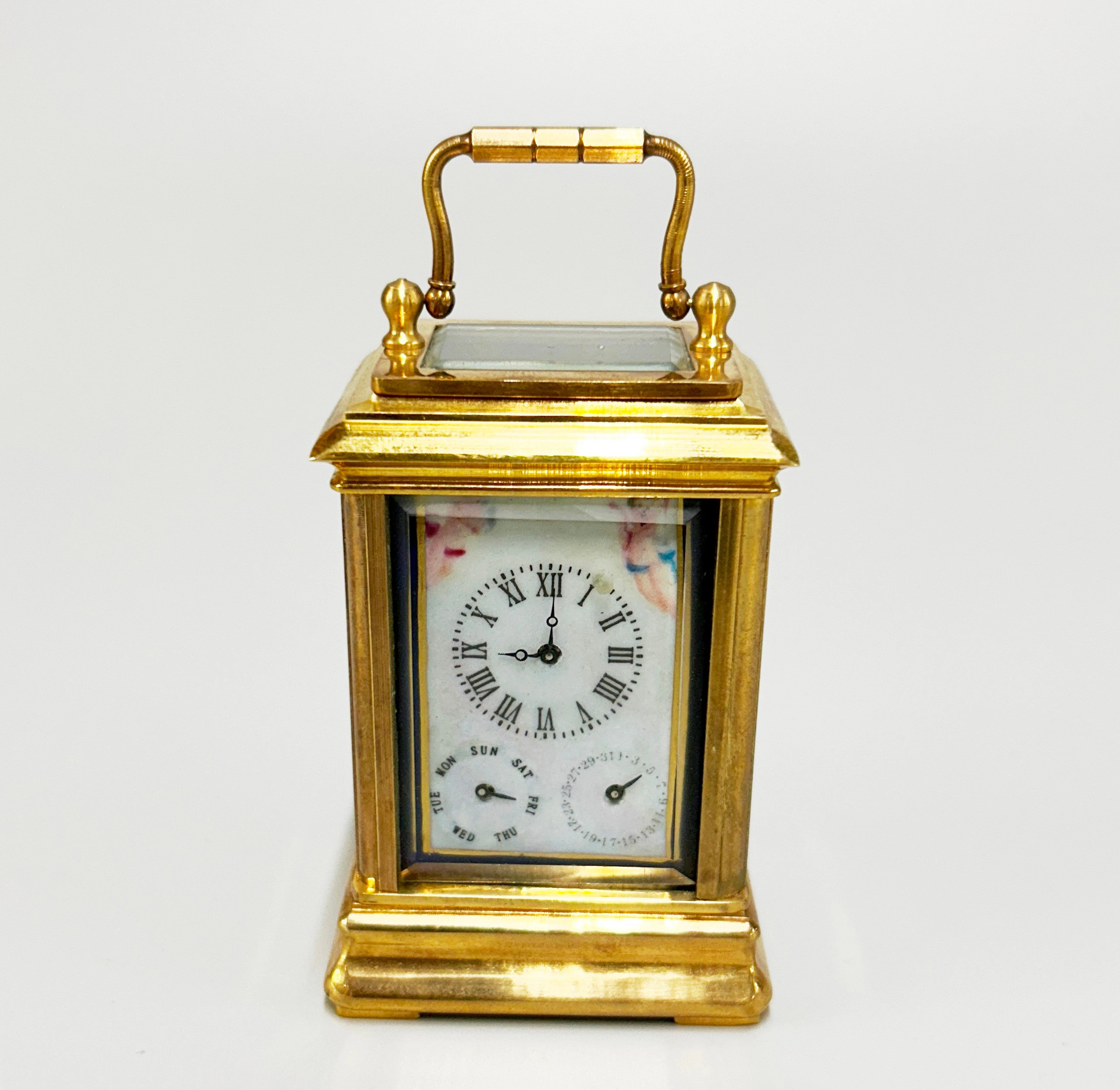 CHERUB CARRIAGE CLOCK.