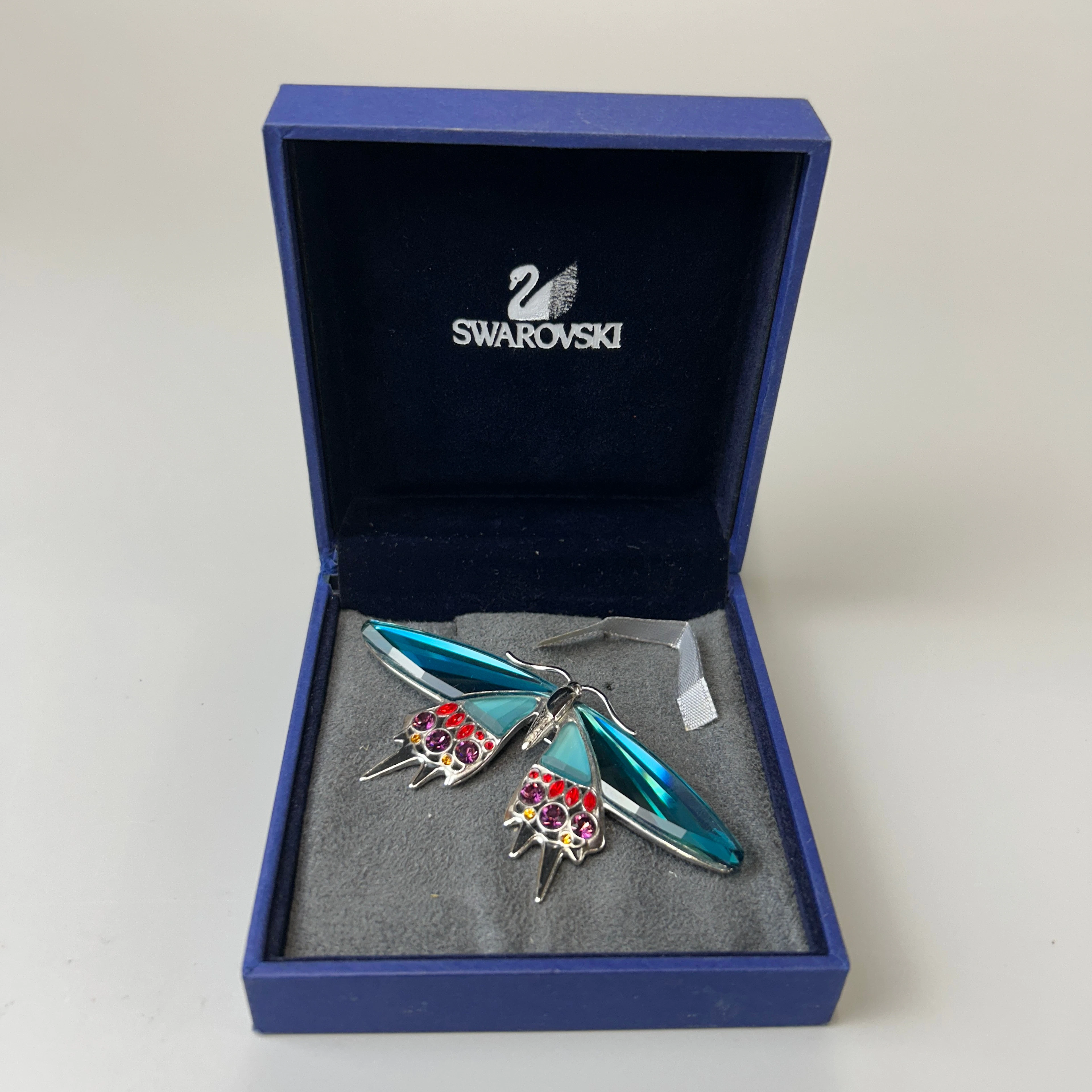 BOXED SWAROVSKI BROOCH.