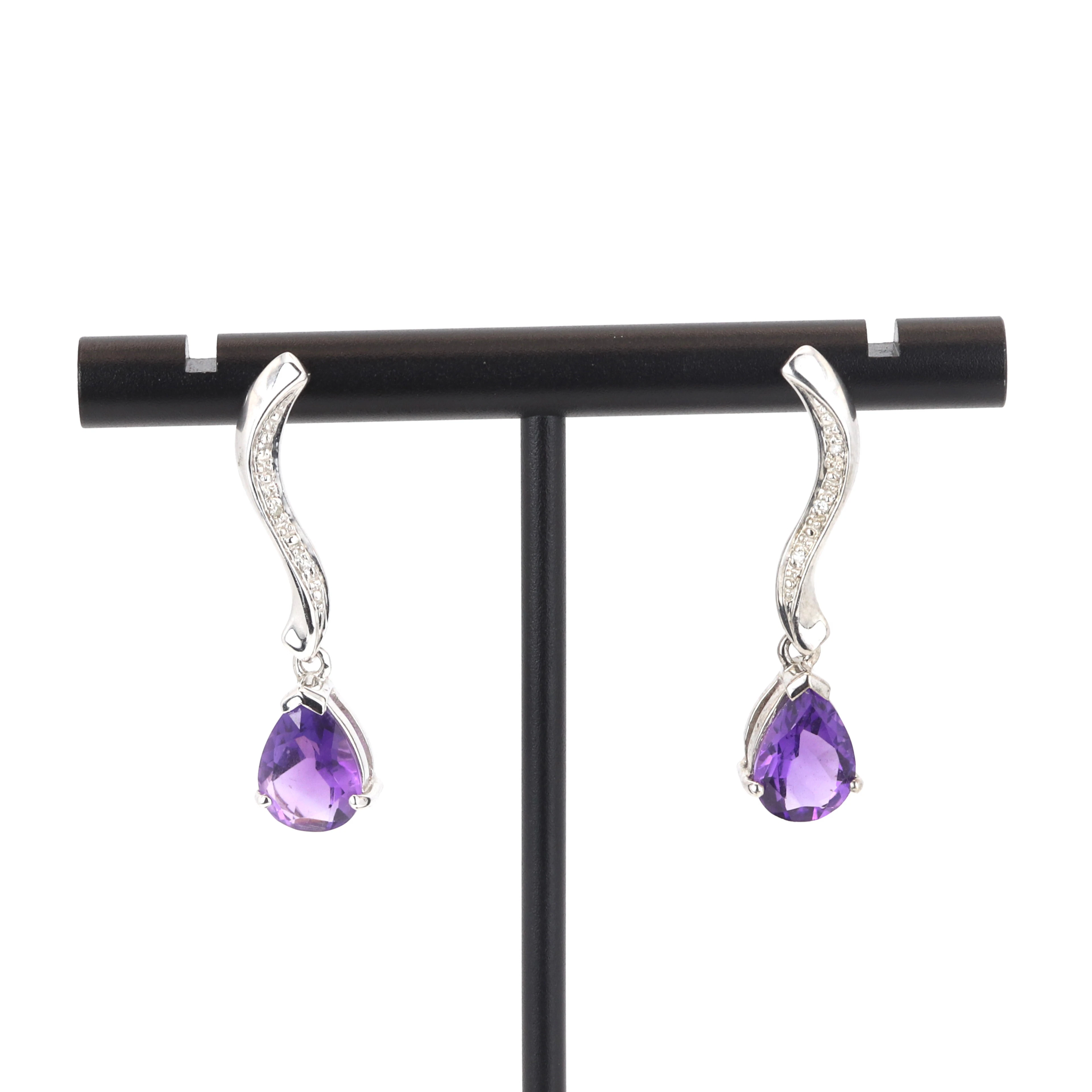 9CT AMETHYST AND DIAMOND EARRINGS.