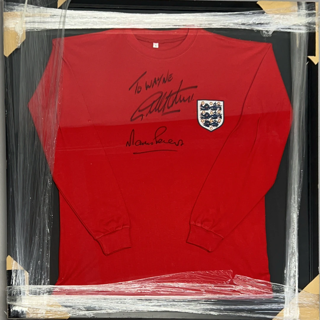 SIGNED GEOFF HURST & MARTIN PETERS ENGLAND SHIRT.