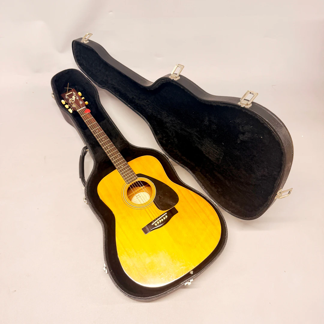 CASED YAMAHA GUITAR.
