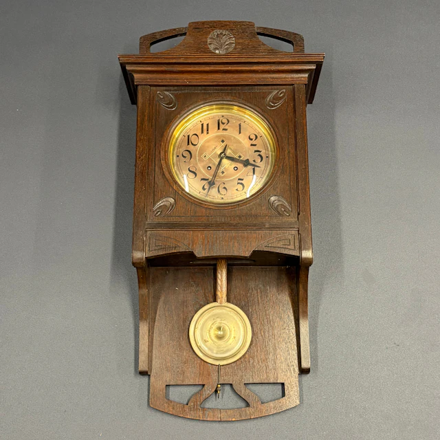 CARVED OAK CLOCK.