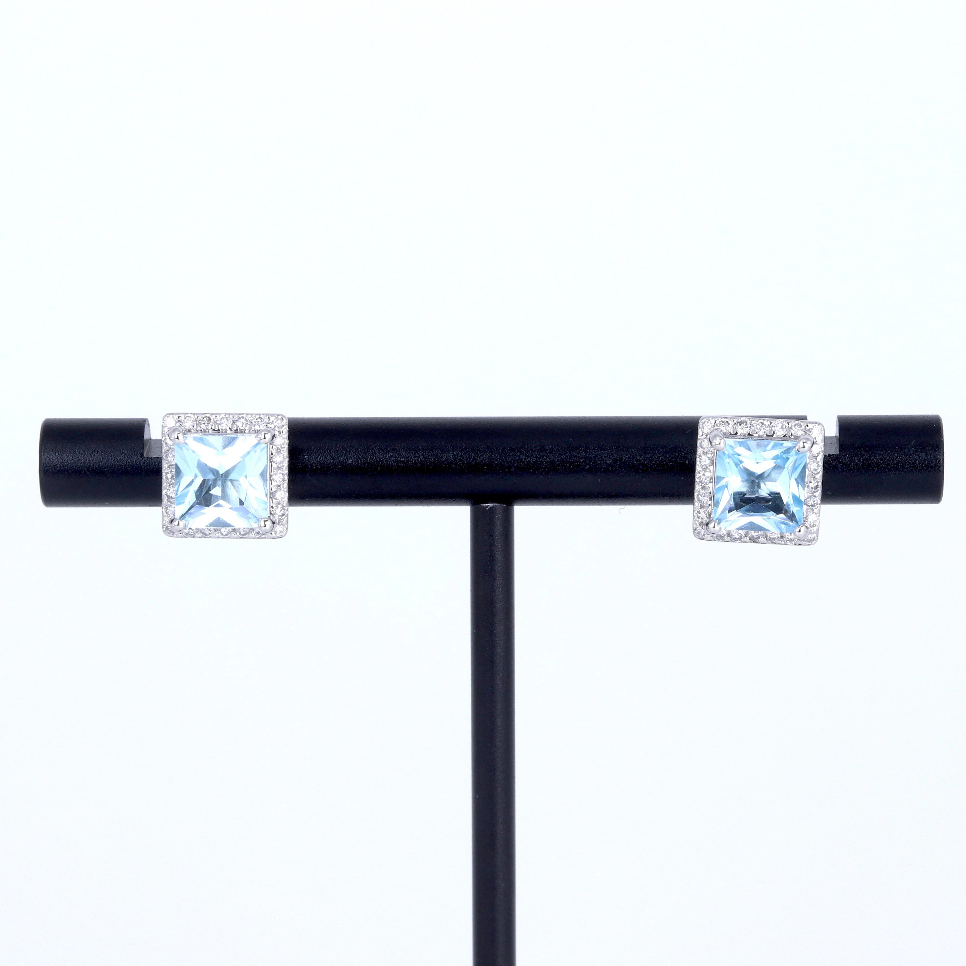 PLATINUM BLUE TOPAZ AND DIAMOND EARRINGS.