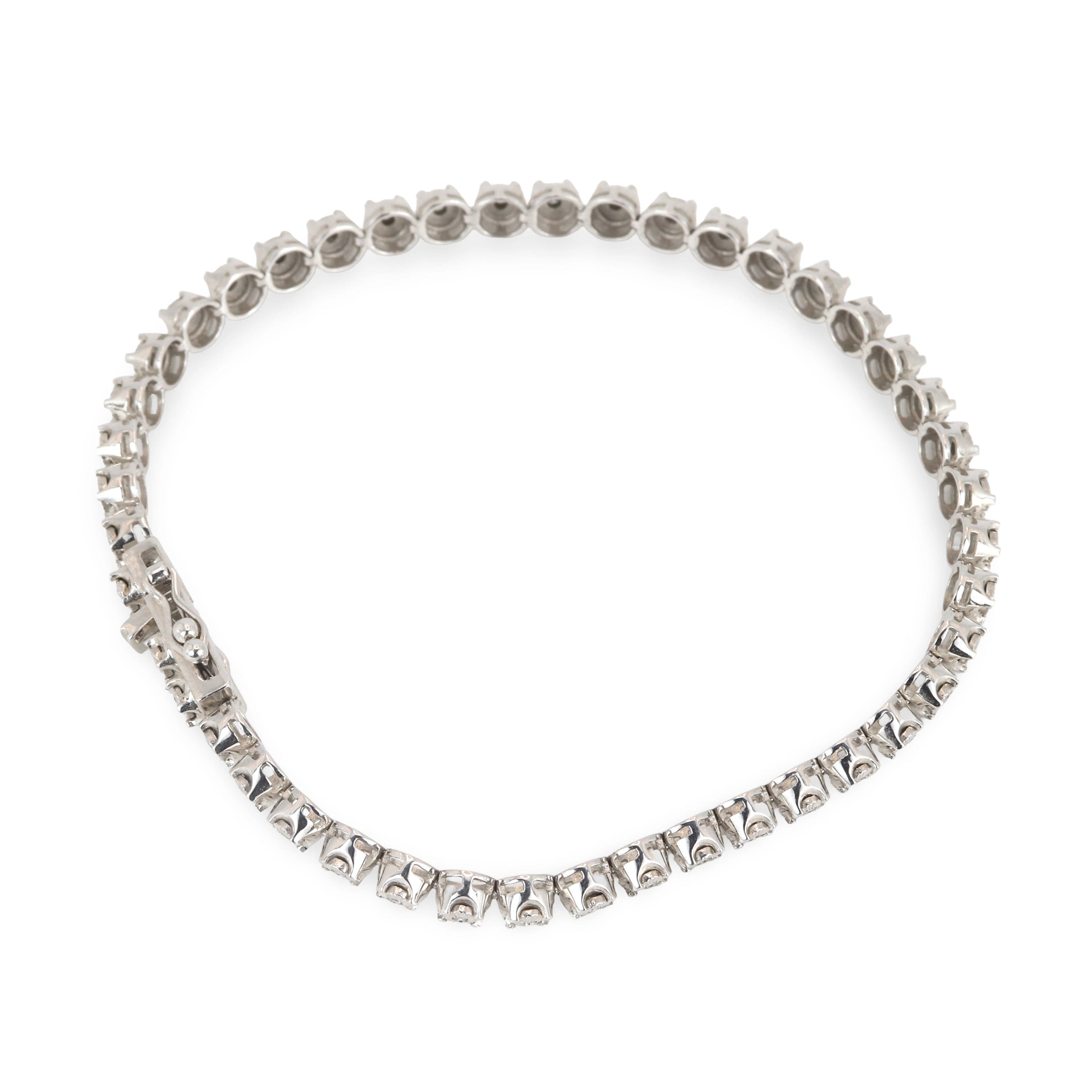 14CT GOLD DIAMOND TENNIS BRACELET.
