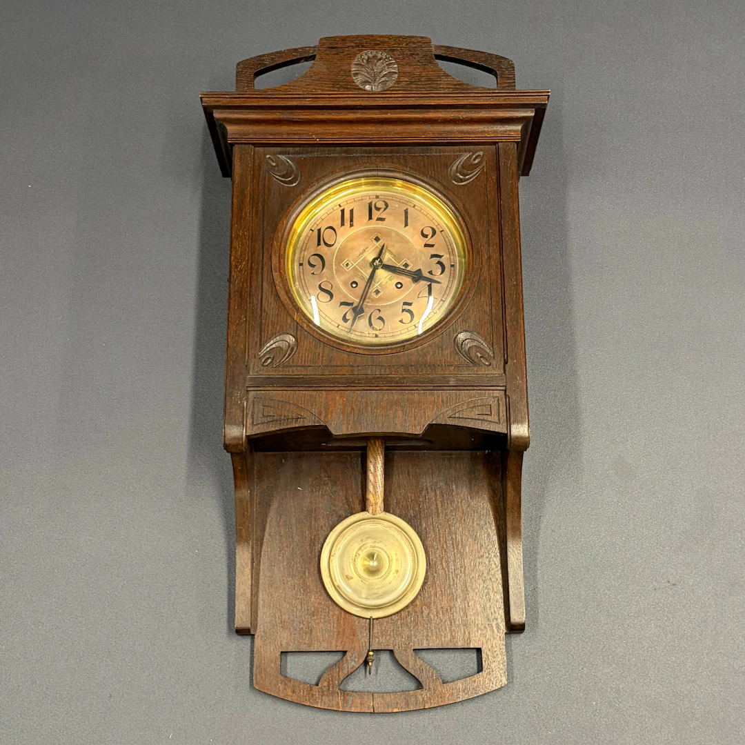 CARVED OAK CLOCK.