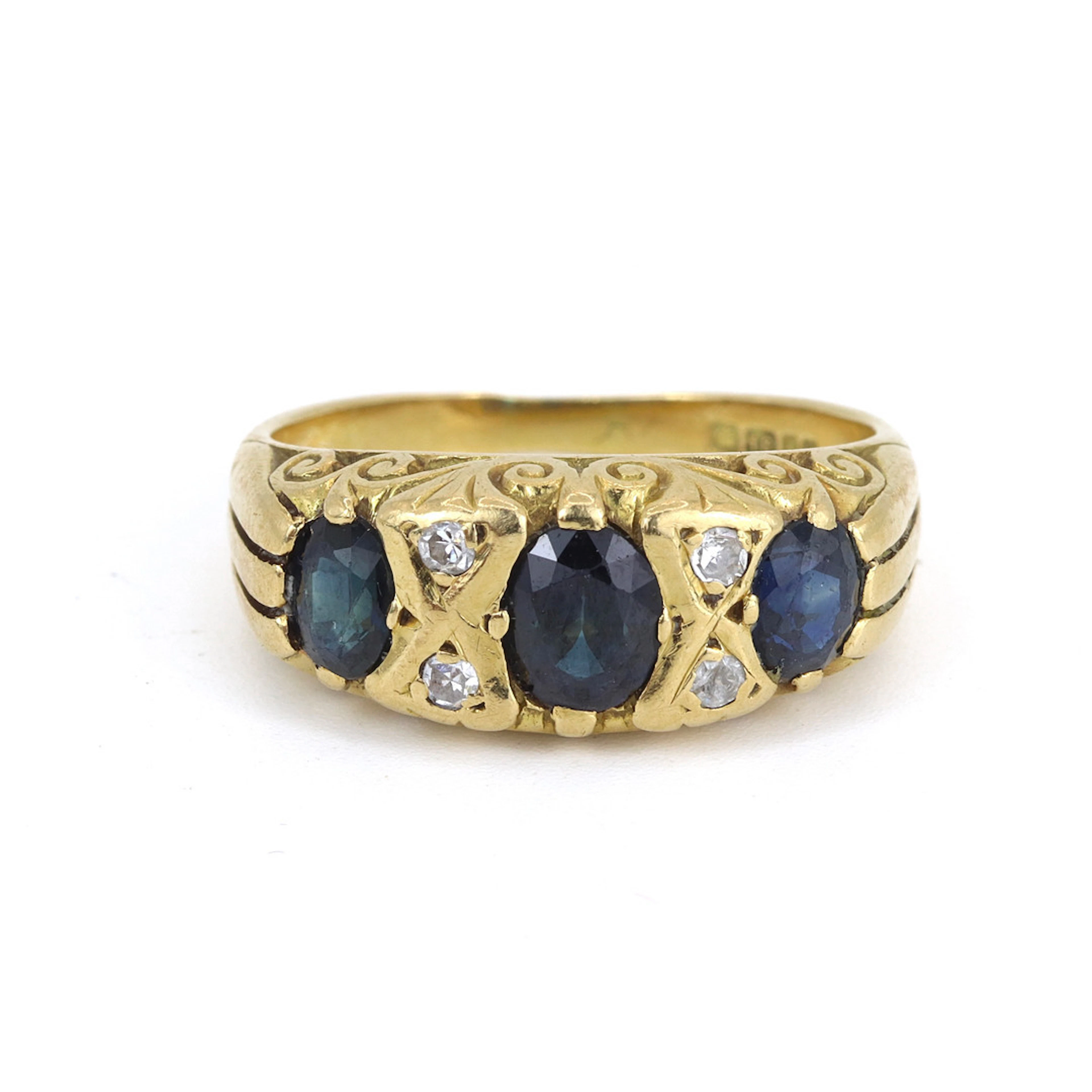 18CT GOLD SAPPHIRE & DIAMOND RING.