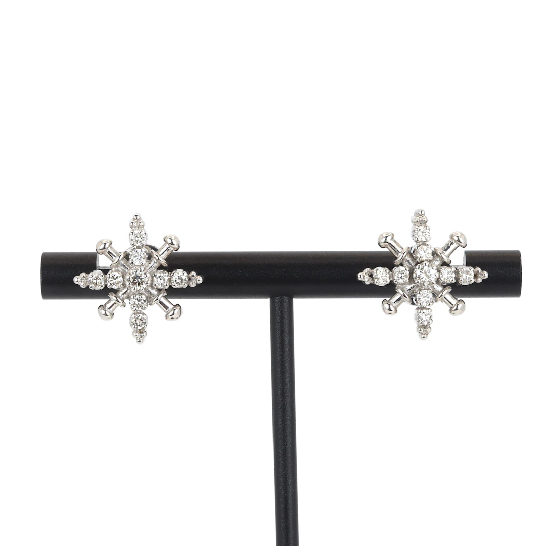 9CT GOLD DIAMOND EARRINGS.