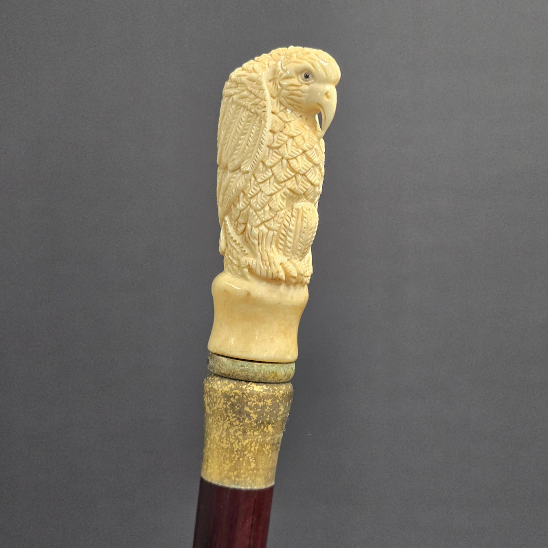 CARVED BONE HANDLED WALKING STICK.