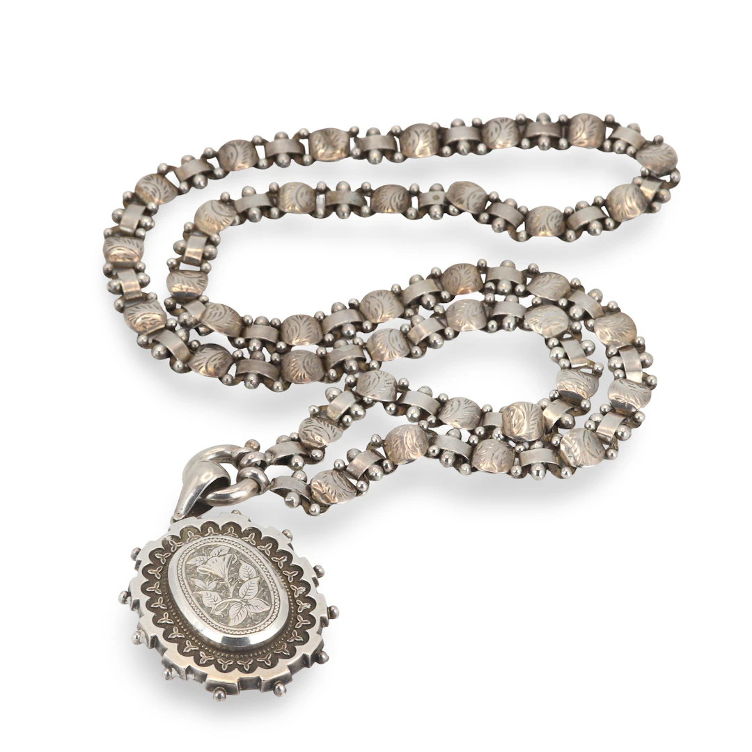 HEAVY SILVER LOCKET AND CHAIN.