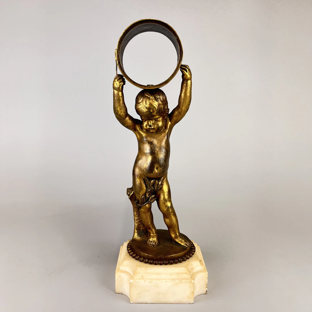 BRONZE PUTTI CLOCK CASE.